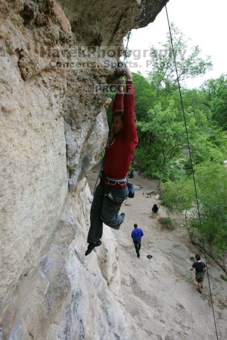 Me top rope climbing Diving for Rocks (5.10d), photographed from  the third bolt of Magster (5.10a) by Andrew Dreher.  It was another long day of rock climbing at Seismic Wall on Austin's Barton Creek Greenbelt, Saturday, April 11, 2009.

Filename: SRM_20090411_17165044.JPG
Aperture: f/5.6
Shutter Speed: 1/320
Body: Canon EOS-1D Mark II
Lens: Canon EF 16-35mm f/2.8 L