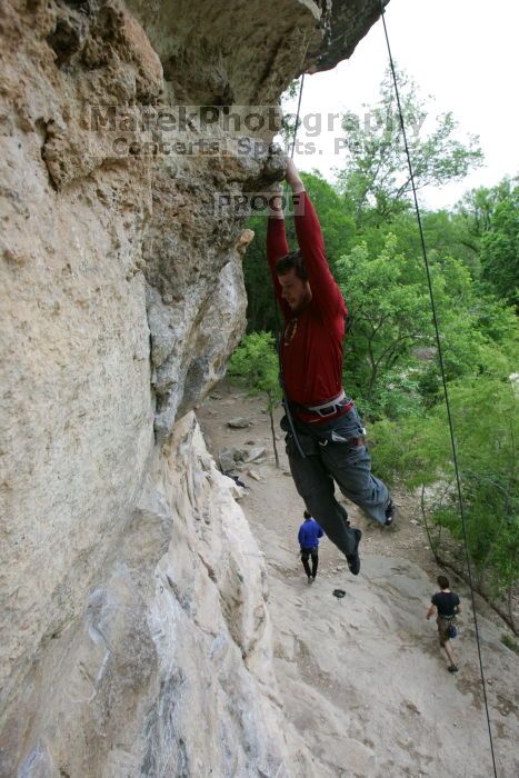 Me top rope climbing Diving for Rocks (5.10d), photographed from  the third bolt of Magster (5.10a) by Andrew Dreher.  It was another long day of rock climbing at Seismic Wall on Austin's Barton Creek Greenbelt, Saturday, April 11, 2009.

Filename: SRM_20090411_17165145.JPG
Aperture: f/5.6
Shutter Speed: 1/320
Body: Canon EOS-1D Mark II
Lens: Canon EF 16-35mm f/2.8 L