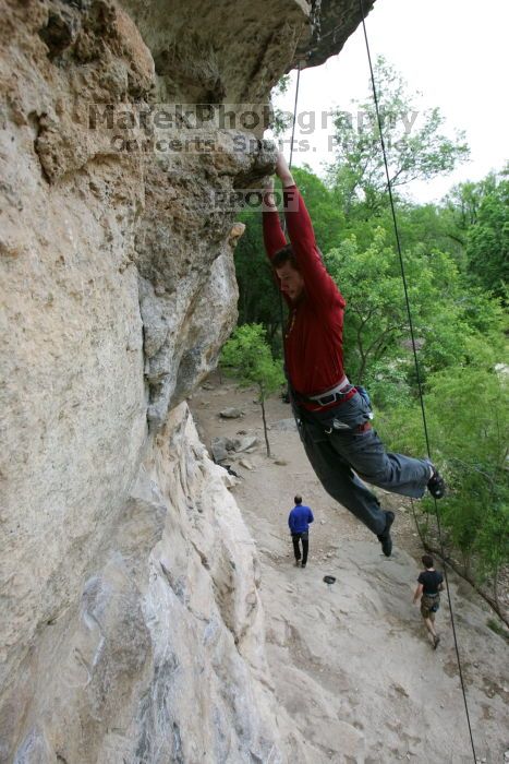 Me top rope climbing Diving for Rocks (5.10d), photographed from  the third bolt of Magster (5.10a) by Andrew Dreher.  It was another long day of rock climbing at Seismic Wall on Austin's Barton Creek Greenbelt, Saturday, April 11, 2009.

Filename: SRM_20090411_17165146.JPG
Aperture: f/5.6
Shutter Speed: 1/320
Body: Canon EOS-1D Mark II
Lens: Canon EF 16-35mm f/2.8 L