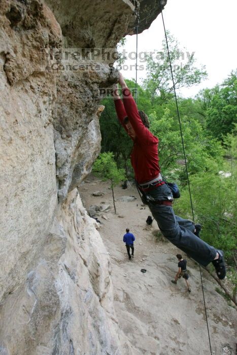 Me top rope climbing Diving for Rocks (5.10d), photographed from  the third bolt of Magster (5.10a) by Andrew Dreher.  It was another long day of rock climbing at Seismic Wall on Austin's Barton Creek Greenbelt, Saturday, April 11, 2009.

Filename: SRM_20090411_17165148.JPG
Aperture: f/5.6
Shutter Speed: 1/320
Body: Canon EOS-1D Mark II
Lens: Canon EF 16-35mm f/2.8 L