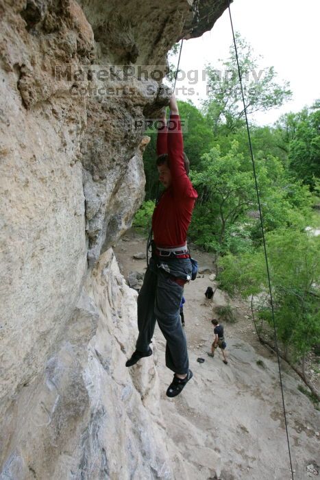 Me top rope climbing Diving for Rocks (5.10d), photographed from  the third bolt of Magster (5.10a) by Andrew Dreher.  It was another long day of rock climbing at Seismic Wall on Austin's Barton Creek Greenbelt, Saturday, April 11, 2009.

Filename: SRM_20090411_17165251.JPG
Aperture: f/5.6
Shutter Speed: 1/320
Body: Canon EOS-1D Mark II
Lens: Canon EF 16-35mm f/2.8 L