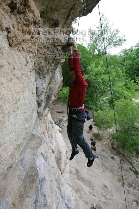 Me top rope climbing Diving for Rocks (5.10d), photographed from  the third bolt of Magster (5.10a) by Andrew Dreher.  It was another long day of rock climbing at Seismic Wall on Austin's Barton Creek Greenbelt, Saturday, April 11, 2009.

Filename: SRM_20090411_17165352.JPG
Aperture: f/5.6
Shutter Speed: 1/320
Body: Canon EOS-1D Mark II
Lens: Canon EF 16-35mm f/2.8 L