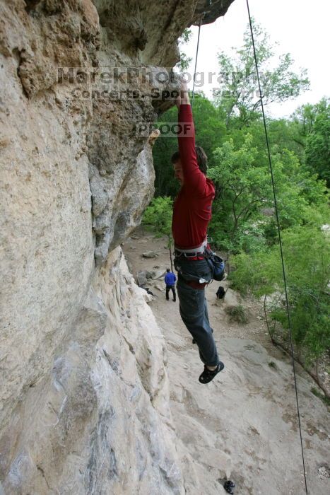 Me top rope climbing Diving for Rocks (5.10d), photographed from  the third bolt of Magster (5.10a) by Andrew Dreher.  It was another long day of rock climbing at Seismic Wall on Austin's Barton Creek Greenbelt, Saturday, April 11, 2009.

Filename: SRM_20090411_17165553.JPG
Aperture: f/5.6
Shutter Speed: 1/320
Body: Canon EOS-1D Mark II
Lens: Canon EF 16-35mm f/2.8 L