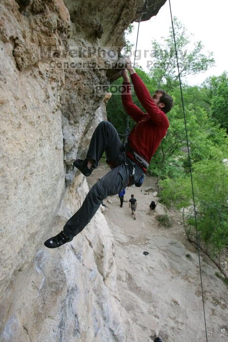 Me top rope climbing Diving for Rocks (5.10d), photographed from  the third bolt of Magster (5.10a) by Andrew Dreher.  It was another long day of rock climbing at Seismic Wall on Austin's Barton Creek Greenbelt, Saturday, April 11, 2009.

Filename: SRM_20090411_17165655.JPG
Aperture: f/5.6
Shutter Speed: 1/320
Body: Canon EOS-1D Mark II
Lens: Canon EF 16-35mm f/2.8 L