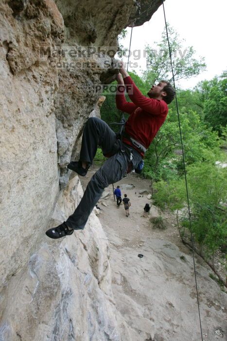 Me top rope climbing Diving for Rocks (5.10d), photographed from  the third bolt of Magster (5.10a) by Andrew Dreher.  It was another long day of rock climbing at Seismic Wall on Austin's Barton Creek Greenbelt, Saturday, April 11, 2009.

Filename: SRM_20090411_17165756.JPG
Aperture: f/5.6
Shutter Speed: 1/320
Body: Canon EOS-1D Mark II
Lens: Canon EF 16-35mm f/2.8 L