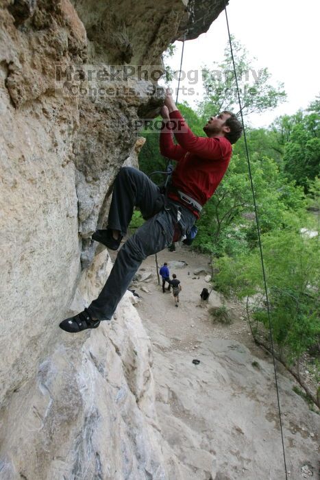 Me top rope climbing Diving for Rocks (5.10d), photographed from  the third bolt of Magster (5.10a) by Andrew Dreher.  It was another long day of rock climbing at Seismic Wall on Austin's Barton Creek Greenbelt, Saturday, April 11, 2009.

Filename: SRM_20090411_17165757.JPG
Aperture: f/5.6
Shutter Speed: 1/320
Body: Canon EOS-1D Mark II
Lens: Canon EF 16-35mm f/2.8 L