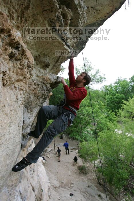 Me top rope climbing Diving for Rocks (5.10d), photographed from  the third bolt of Magster (5.10a) by Andrew Dreher.  It was another long day of rock climbing at Seismic Wall on Austin's Barton Creek Greenbelt, Saturday, April 11, 2009.

Filename: SRM_20090411_17165859.JPG
Aperture: f/5.6
Shutter Speed: 1/320
Body: Canon EOS-1D Mark II
Lens: Canon EF 16-35mm f/2.8 L