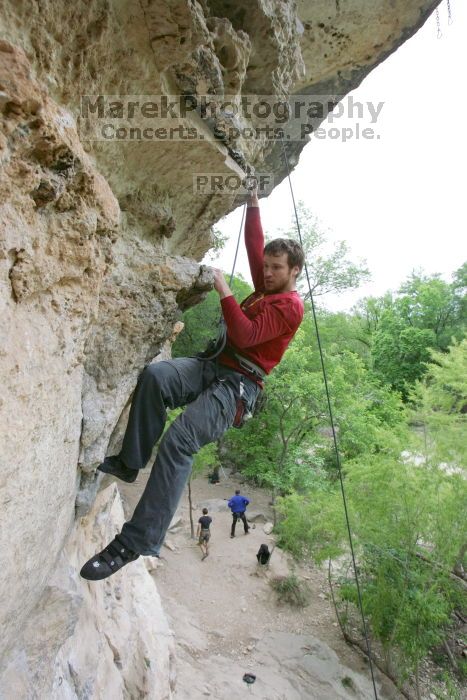 Me top rope climbing Diving for Rocks (5.10d), photographed from  the third bolt of Magster (5.10a) by Andrew Dreher.  It was another long day of rock climbing at Seismic Wall on Austin's Barton Creek Greenbelt, Saturday, April 11, 2009.

Filename: SRM_20090411_17165960.JPG
Aperture: f/5.6
Shutter Speed: 1/320
Body: Canon EOS-1D Mark II
Lens: Canon EF 16-35mm f/2.8 L