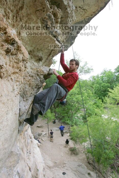 Me top rope climbing Diving for Rocks (5.10d), photographed from  the third bolt of Magster (5.10a) by Andrew Dreher.  It was another long day of rock climbing at Seismic Wall on Austin's Barton Creek Greenbelt, Saturday, April 11, 2009.

Filename: SRM_20090411_17165961.JPG
Aperture: f/5.6
Shutter Speed: 1/320
Body: Canon EOS-1D Mark II
Lens: Canon EF 16-35mm f/2.8 L