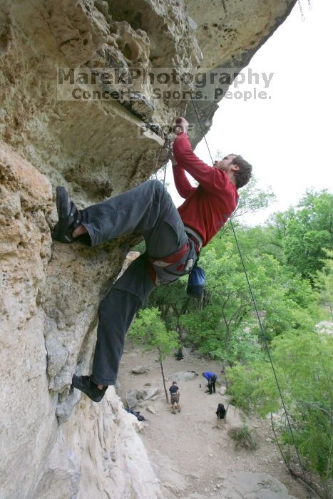 Me top rope climbing Diving for Rocks (5.10d), photographed from  the third bolt of Magster (5.10a) by Andrew Dreher.  It was another long day of rock climbing at Seismic Wall on Austin's Barton Creek Greenbelt, Saturday, April 11, 2009.

Filename: SRM_20090411_17170165.JPG
Aperture: f/5.6
Shutter Speed: 1/320
Body: Canon EOS-1D Mark II
Lens: Canon EF 16-35mm f/2.8 L