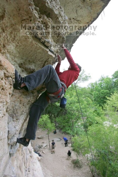 Me top rope climbing Diving for Rocks (5.10d), photographed from  the third bolt of Magster (5.10a) by Andrew Dreher.  It was another long day of rock climbing at Seismic Wall on Austin's Barton Creek Greenbelt, Saturday, April 11, 2009.

Filename: SRM_20090411_17170367.JPG
Aperture: f/5.6
Shutter Speed: 1/320
Body: Canon EOS-1D Mark II
Lens: Canon EF 16-35mm f/2.8 L