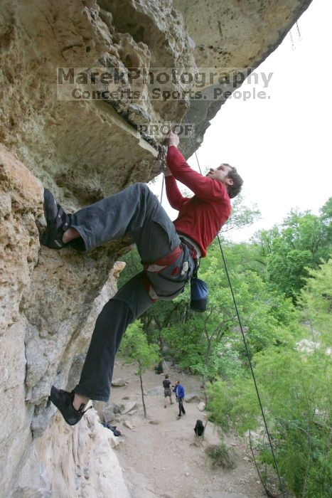 Me top rope climbing Diving for Rocks (5.10d), photographed from  the third bolt of Magster (5.10a) by Andrew Dreher.  It was another long day of rock climbing at Seismic Wall on Austin's Barton Creek Greenbelt, Saturday, April 11, 2009.

Filename: SRM_20090411_17170768.JPG
Aperture: f/5.6
Shutter Speed: 1/320
Body: Canon EOS-1D Mark II
Lens: Canon EF 16-35mm f/2.8 L