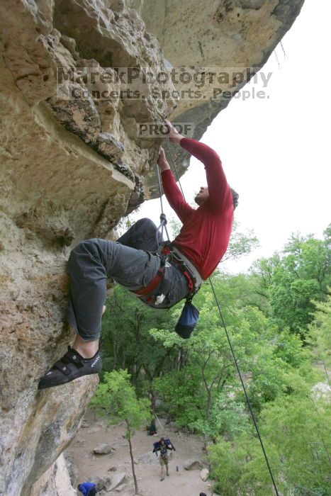 Me top rope climbing Diving for Rocks (5.10d), photographed from  the third bolt of Magster (5.10a) by Andrew Dreher.  It was another long day of rock climbing at Seismic Wall on Austin's Barton Creek Greenbelt, Saturday, April 11, 2009.

Filename: SRM_20090411_17171372.JPG
Aperture: f/5.6
Shutter Speed: 1/320
Body: Canon EOS-1D Mark II
Lens: Canon EF 16-35mm f/2.8 L