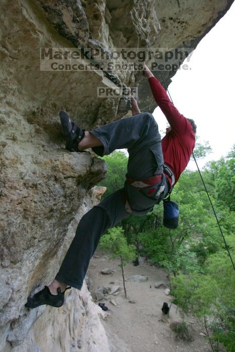 Me top rope climbing Diving for Rocks (5.10d), photographed from  the third bolt of Magster (5.10a) by Andrew Dreher.  It was another long day of rock climbing at Seismic Wall on Austin's Barton Creek Greenbelt, Saturday, April 11, 2009.

Filename: SRM_20090411_17185879.JPG
Aperture: f/5.6
Shutter Speed: 1/320
Body: Canon EOS-1D Mark II
Lens: Canon EF 16-35mm f/2.8 L