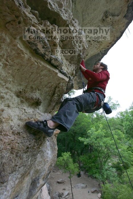 Me top rope climbing Diving for Rocks (5.10d), photographed from  the third bolt of Magster (5.10a) by Andrew Dreher.  It was another long day of rock climbing at Seismic Wall on Austin's Barton Creek Greenbelt, Saturday, April 11, 2009.

Filename: SRM_20090411_17190280.JPG
Aperture: f/5.6
Shutter Speed: 1/320
Body: Canon EOS-1D Mark II
Lens: Canon EF 16-35mm f/2.8 L