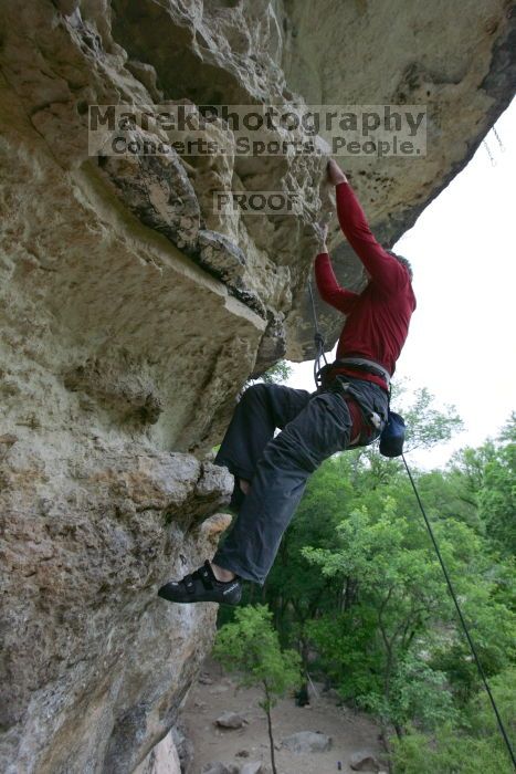 Me top rope climbing Diving for Rocks (5.10d), photographed from  the third bolt of Magster (5.10a) by Andrew Dreher.  It was another long day of rock climbing at Seismic Wall on Austin's Barton Creek Greenbelt, Saturday, April 11, 2009.

Filename: SRM_20090411_17190482.JPG
Aperture: f/5.6
Shutter Speed: 1/320
Body: Canon EOS-1D Mark II
Lens: Canon EF 16-35mm f/2.8 L