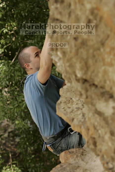 Sean O'Grady climbs in just running shoes.  CTM hosted a speed climbing event at Seismic Wall on Diving for Rocks to benefit the Austin Area Food Bank, Saturday, May 9, 2009.

Filename: SRM_20090509_11315200.jpg
Aperture: f/5.6
Shutter Speed: 1/640
Body: Canon EOS-1D Mark II
Lens: Canon EF 80-200mm f/2.8 L