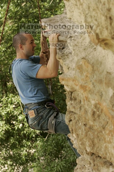 Sean O'Grady climbs in just running shoes.  CTM hosted a speed climbing event at Seismic Wall on Diving for Rocks to benefit the Austin Area Food Bank, Saturday, May 9, 2009.

Filename: SRM_20090509_11320115.jpg
Aperture: f/5.6
Shutter Speed: 1/500
Body: Canon EOS-1D Mark II
Lens: Canon EF 80-200mm f/2.8 L