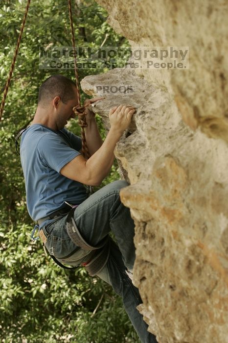 Sean O'Grady climbs in just running shoes.  CTM hosted a speed climbing event at Seismic Wall on Diving for Rocks to benefit the Austin Area Food Bank, Saturday, May 9, 2009.

Filename: SRM_20090509_11320218.jpg
Aperture: f/5.6
Shutter Speed: 1/500
Body: Canon EOS-1D Mark II
Lens: Canon EF 80-200mm f/2.8 L