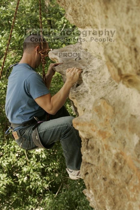 Sean O'Grady climbs in just running shoes.  CTM hosted a speed climbing event at Seismic Wall on Diving for Rocks to benefit the Austin Area Food Bank, Saturday, May 9, 2009.

Filename: SRM_20090509_11320319.jpg
Aperture: f/5.6
Shutter Speed: 1/500
Body: Canon EOS-1D Mark II
Lens: Canon EF 80-200mm f/2.8 L