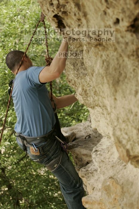 Sean O'Grady climbs in just running shoes.  CTM hosted a speed climbing event at Seismic Wall on Diving for Rocks to benefit the Austin Area Food Bank, Saturday, May 9, 2009.

Filename: SRM_20090509_11320828.jpg
Aperture: f/5.6
Shutter Speed: 1/400
Body: Canon EOS-1D Mark II
Lens: Canon EF 80-200mm f/2.8 L