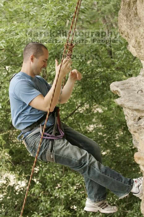 Sean O'Grady climbs in just running shoes.  CTM hosted a speed climbing event at Seismic Wall on Diving for Rocks to benefit the Austin Area Food Bank, Saturday, May 9, 2009.

Filename: SRM_20090509_11321234.jpg
Aperture: f/5.6
Shutter Speed: 1/250
Body: Canon EOS-1D Mark II
Lens: Canon EF 80-200mm f/2.8 L