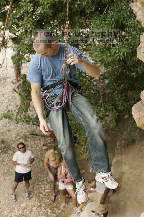 Sean O'Grady climbs in just running shoes.  CTM hosted a speed climbing event at Seismic Wall on Diving for Rocks to benefit the Austin Area Food Bank, Saturday, May 9, 2009.

Filename: SRM_20090509_11321438.jpg
Aperture: f/5.6
Shutter Speed: 1/320
Body: Canon EOS-1D Mark II
Lens: Canon EF 80-200mm f/2.8 L