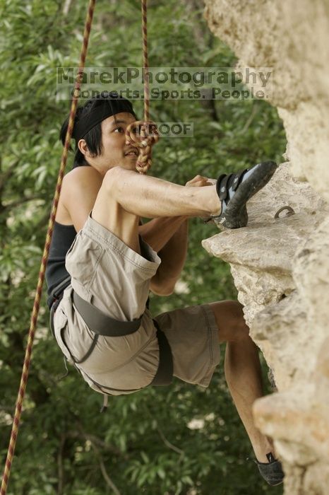 Long Ta, winner of the speed competition with a time of 15.33 seconds.  CTM hosted a speed climbing event at Seismic Wall on Diving for Rocks to benefit the Austin Area Food Bank, Saturday, May 9, 2009.

Filename: SRM_20090509_11333349.jpg
Aperture: f/5.6
Shutter Speed: 1/250
Body: Canon EOS-1D Mark II
Lens: Canon EF 80-200mm f/2.8 L