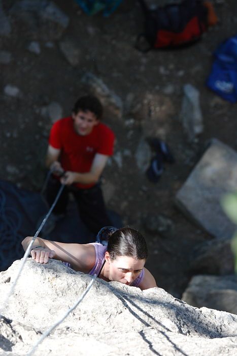 Beth Marek top rope climbing Roo Dog (5.8) with Andrew Dreher belaying, taken from the anchors of the route.  It was Beth's third time outside, and another long day of rock climbing at Seismic Wall on Austin's Barton Creek Greenbelt, Monday, May 25, 2009.

Filename: SRM_20090525_09415093.JPG
Aperture: f/4.0
Shutter Speed: 1/640
Body: Canon EOS-1D Mark II
Lens: Canon EF 80-200mm f/2.8 L