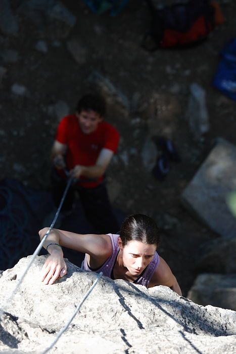 Beth Marek top rope climbing Roo Dog (5.8) with Andrew Dreher belaying, taken from the anchors of the route.  It was Beth's third time outside, and another long day of rock climbing at Seismic Wall on Austin's Barton Creek Greenbelt, Monday, May 25, 2009.

Filename: SRM_20090525_09415295.JPG
Aperture: f/4.0
Shutter Speed: 1/640
Body: Canon EOS-1D Mark II
Lens: Canon EF 80-200mm f/2.8 L