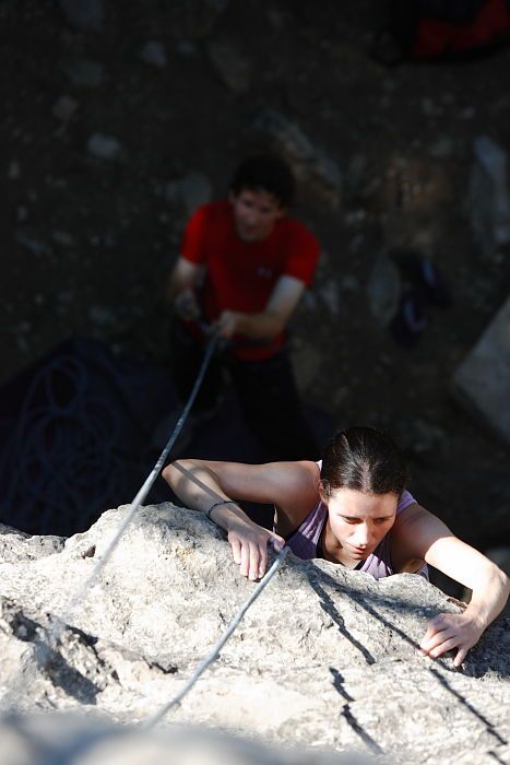 Beth Marek top rope climbing Roo Dog (5.8) with Andrew Dreher belaying, taken from the anchors of the route.  It was Beth's third time outside, and another long day of rock climbing at Seismic Wall on Austin's Barton Creek Greenbelt, Monday, May 25, 2009.

Filename: SRM_20090525_09415497.JPG
Aperture: f/4.0
Shutter Speed: 1/800
Body: Canon EOS-1D Mark II
Lens: Canon EF 80-200mm f/2.8 L