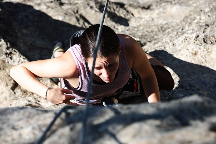 Beth Marek top rope climbing Roo Dog (5.8), taken from the anchors of the route.  It was Beth's third time outside, and another long day of rock climbing at Seismic Wall on Austin's Barton Creek Greenbelt, Monday, May 25, 2009.

Filename: SRM_20090525_09440716.JPG
Aperture: f/5.6
Shutter Speed: 1/1250
Body: Canon EOS-1D Mark II
Lens: Canon EF 80-200mm f/2.8 L