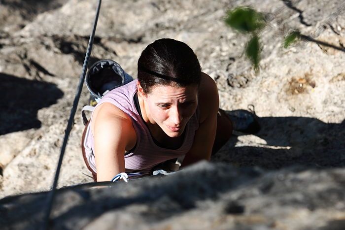 Beth Marek top rope climbing Roo Dog (5.8), taken from the anchors of the route.  It was Beth's third time outside, and another long day of rock climbing at Seismic Wall on Austin's Barton Creek Greenbelt, Monday, May 25, 2009.

Filename: SRM_20090525_09441317.JPG
Aperture: f/5.6
Shutter Speed: 1/1600
Body: Canon EOS-1D Mark II
Lens: Canon EF 80-200mm f/2.8 L