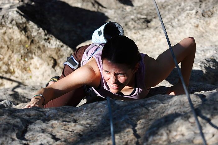 Beth Marek top rope climbing Roo Dog (5.8), taken from the anchors of the route.  It was Beth's third time outside, and another long day of rock climbing at Seismic Wall on Austin's Barton Creek Greenbelt, Monday, May 25, 2009.

Filename: SRM_20090525_09485834.JPG
Aperture: f/5.0
Shutter Speed: 1/2000
Body: Canon EOS-1D Mark II
Lens: Canon EF 80-200mm f/2.8 L