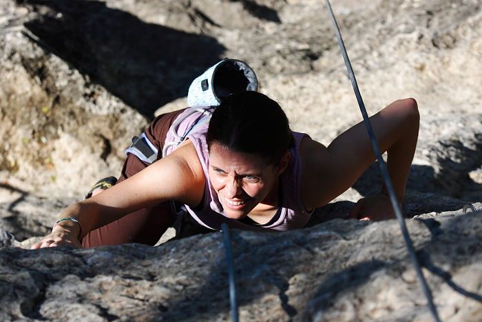 Beth Marek top rope climbing Roo Dog (5.8), taken from the anchors of the route.  It was Beth's third time outside, and another long day of rock climbing at Seismic Wall on Austin's Barton Creek Greenbelt, Monday, May 25, 2009.

Filename: SRM_20090525_09485835.JPG
Aperture: f/5.0
Shutter Speed: 1/2000
Body: Canon EOS-1D Mark II
Lens: Canon EF 80-200mm f/2.8 L