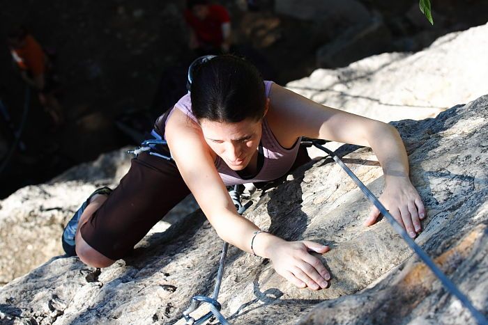 Beth Marek top rope climbing Roo Dog (5.8), taken from the anchors of the route.  It was Beth's third time outside, and another long day of rock climbing at Seismic Wall on Austin's Barton Creek Greenbelt, Monday, May 25, 2009.

Filename: SRM_20090525_09520292.JPG
Aperture: f/5.6
Shutter Speed: 1/500
Body: Canon EOS-1D Mark II
Lens: Canon EF 80-200mm f/2.8 L