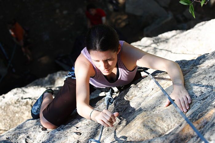 Beth Marek top rope climbing Roo Dog (5.8), taken from the anchors of the route.  It was Beth's third time outside, and another long day of rock climbing at Seismic Wall on Austin's Barton Creek Greenbelt, Monday, May 25, 2009.

Filename: SRM_20090525_09520294.JPG
Aperture: f/5.6
Shutter Speed: 1/400
Body: Canon EOS-1D Mark II
Lens: Canon EF 80-200mm f/2.8 L