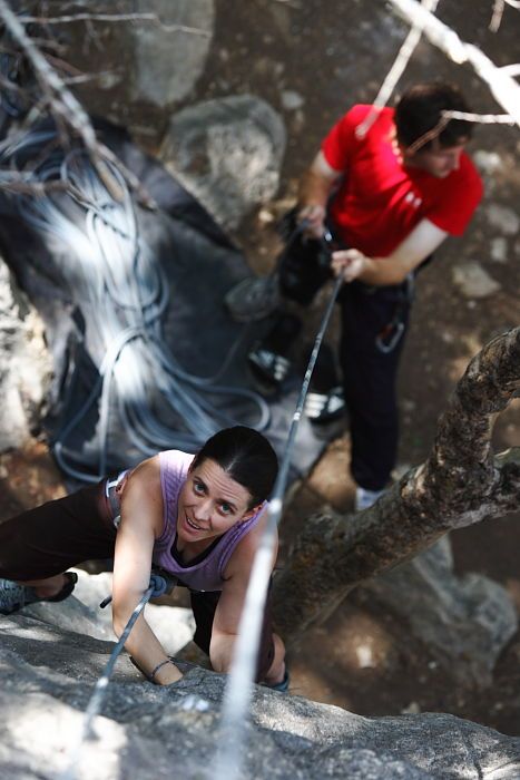 Beth Marek top rope climbing Hollywood (5.7) with Andrew Dreher belaying, taken from the anchors of the route.  It was Beth's third time outside, and another long day of rock climbing at Seismic Wall on Austin's Barton Creek Greenbelt, Monday, May 25, 2009.

Filename: SRM_20090525_10375710.JPG
Aperture: f/4.0
Shutter Speed: 1/500
Body: Canon EOS-1D Mark II
Lens: Canon EF 80-200mm f/2.8 L