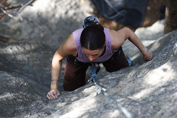 Beth Marek top rope climbing Hollywood (5.7), taken from the anchors of the route.  It was Beth's third time outside, and another long day of rock climbing at Seismic Wall on Austin's Barton Creek Greenbelt, Monday, May 25, 2009.

Filename: SRM_20090525_10382713.JPG
Aperture: f/4.0
Shutter Speed: 1/400
Body: Canon EOS-1D Mark II
Lens: Canon EF 80-200mm f/2.8 L