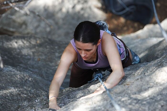 Beth Marek top rope climbing Hollywood (5.7), taken from the anchors of the route.  It was Beth's third time outside, and another long day of rock climbing at Seismic Wall on Austin's Barton Creek Greenbelt, Monday, May 25, 2009.

Filename: SRM_20090525_10382915.JPG
Aperture: f/4.0
Shutter Speed: 1/400
Body: Canon EOS-1D Mark II
Lens: Canon EF 80-200mm f/2.8 L