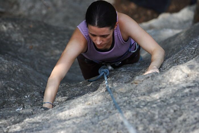 Beth Marek top rope climbing Hollywood (5.7), taken from the anchors of the route.  It was Beth's third time outside, and another long day of rock climbing at Seismic Wall on Austin's Barton Creek Greenbelt, Monday, May 25, 2009.

Filename: SRM_20090525_10383719.JPG
Aperture: f/4.0
Shutter Speed: 1/400
Body: Canon EOS-1D Mark II
Lens: Canon EF 80-200mm f/2.8 L