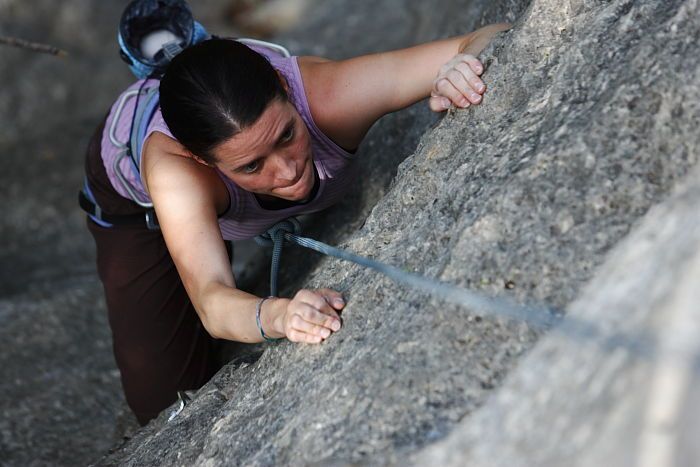 Beth Marek top rope climbing Hollywood (5.7), taken from the anchors of the route.  It was Beth's third time outside, and another long day of rock climbing at Seismic Wall on Austin's Barton Creek Greenbelt, Monday, May 25, 2009.

Filename: SRM_20090525_10392037.JPG
Aperture: f/4.0
Shutter Speed: 1/500
Body: Canon EOS-1D Mark II
Lens: Canon EF 80-200mm f/2.8 L