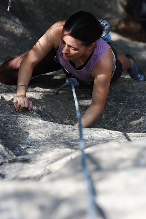 Beth Marek top rope climbing Hollywood (5.7), taken from the anchors of the route.  It was Beth's third time outside, and another long day of rock climbing at Seismic Wall on Austin's Barton Creek Greenbelt, Monday, May 25, 2009.

Filename: SRM_20090525_10394850.JPG
Aperture: f/5.6
Shutter Speed: 1/500
Body: Canon EOS-1D Mark II
Lens: Canon EF 80-200mm f/2.8 L