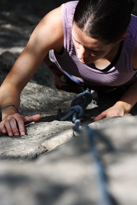 Beth Marek top rope climbing Hollywood (5.7), taken from the anchors of the route.  It was Beth's third time outside, and another long day of rock climbing at Seismic Wall on Austin's Barton Creek Greenbelt, Monday, May 25, 2009.

Filename: SRM_20090525_10400868.JPG
Aperture: f/5.6
Shutter Speed: 1/1000
Body: Canon EOS-1D Mark II
Lens: Canon EF 80-200mm f/2.8 L