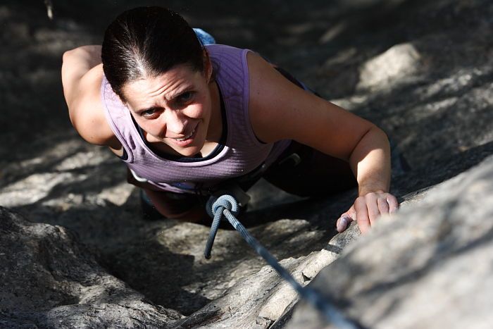 Beth Marek top rope climbing Hollywood (5.7), taken from the anchors of the route.  It was Beth's third time outside, and another long day of rock climbing at Seismic Wall on Austin's Barton Creek Greenbelt, Monday, May 25, 2009.

Filename: SRM_20090525_10402873.JPG
Aperture: f/5.6
Shutter Speed: 1/1000
Body: Canon EOS-1D Mark II
Lens: Canon EF 80-200mm f/2.8 L