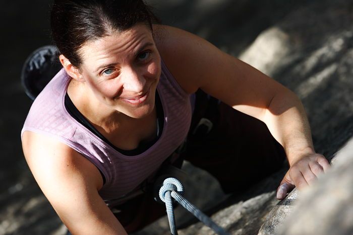 Beth Marek top rope climbing Hollywood (5.7), taken from the anchors of the route.  It was Beth's third time outside, and another long day of rock climbing at Seismic Wall on Austin's Barton Creek Greenbelt, Monday, May 25, 2009.

Filename: SRM_20090525_10403378.JPG
Aperture: f/5.6
Shutter Speed: 1/1000
Body: Canon EOS-1D Mark II
Lens: Canon EF 80-200mm f/2.8 L