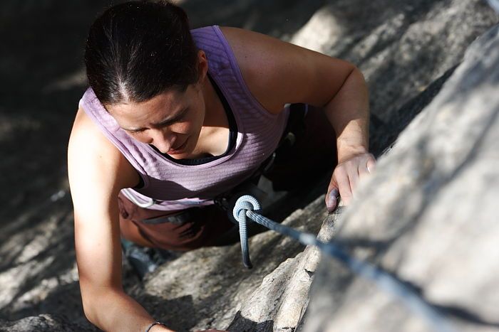 Beth Marek top rope climbing Hollywood (5.7), taken from the anchors of the route.  It was Beth's third time outside, and another long day of rock climbing at Seismic Wall on Austin's Barton Creek Greenbelt, Monday, May 25, 2009.

Filename: SRM_20090525_10404380.JPG
Aperture: f/5.6
Shutter Speed: 1/800
Body: Canon EOS-1D Mark II
Lens: Canon EF 80-200mm f/2.8 L