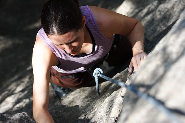 Beth Marek top rope climbing Hollywood (5.7), taken from the anchors of the route.  It was Beth's third time outside, and another long day of rock climbing at Seismic Wall on Austin's Barton Creek Greenbelt, Monday, May 25, 2009.

Filename: SRM_20090525_10404381.JPG
Aperture: f/5.6
Shutter Speed: 1/1000
Body: Canon EOS-1D Mark II
Lens: Canon EF 80-200mm f/2.8 L