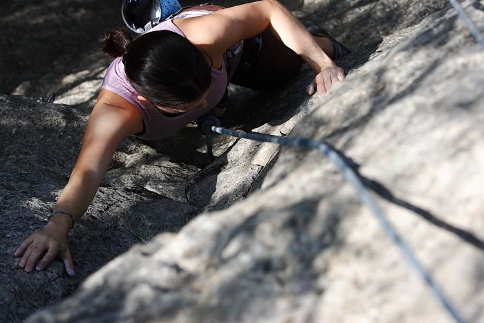 Beth Marek top rope climbing Hollywood (5.7), taken from the anchors of the route.  It was Beth's third time outside, and another long day of rock climbing at Seismic Wall on Austin's Barton Creek Greenbelt, Monday, May 25, 2009.

Filename: SRM_20090525_10404682.JPG
Aperture: f/5.6
Shutter Speed: 1/1250
Body: Canon EOS-1D Mark II
Lens: Canon EF 80-200mm f/2.8 L