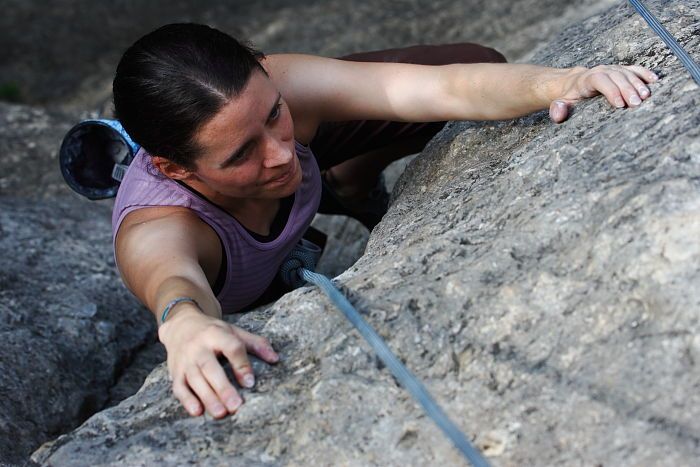 Beth Marek top rope climbing Hollywood (5.7), taken from the anchors of the route.  It was Beth's third time outside, and another long day of rock climbing at Seismic Wall on Austin's Barton Creek Greenbelt, Monday, May 25, 2009.

Filename: SRM_20090525_10423410.JPG
Aperture: f/5.6
Shutter Speed: 1/500
Body: Canon EOS-1D Mark II
Lens: Canon EF 80-200mm f/2.8 L